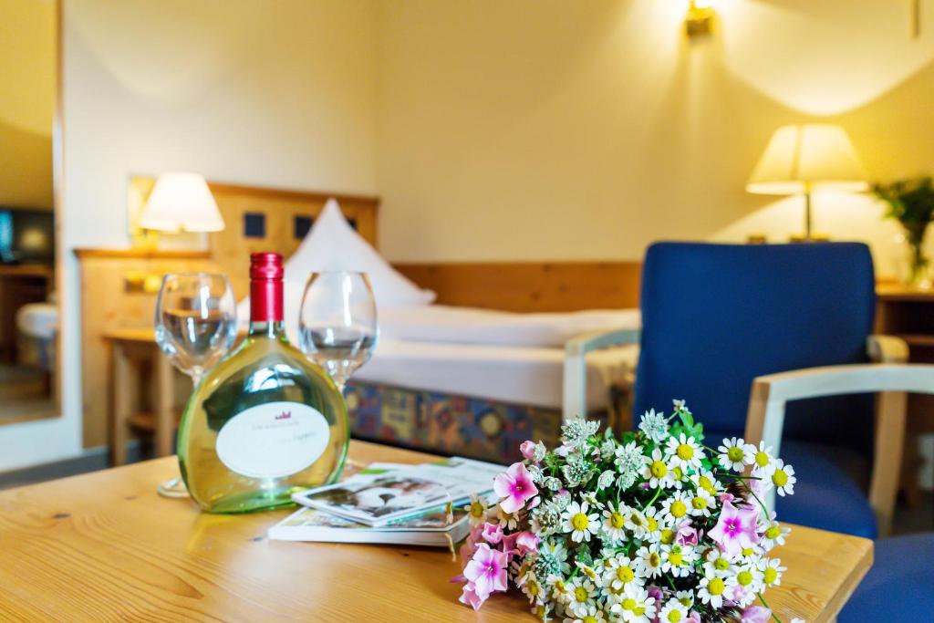 Postel nebo postele na pokoji v ubytování Flair-Hotel Zum Benediktiner
