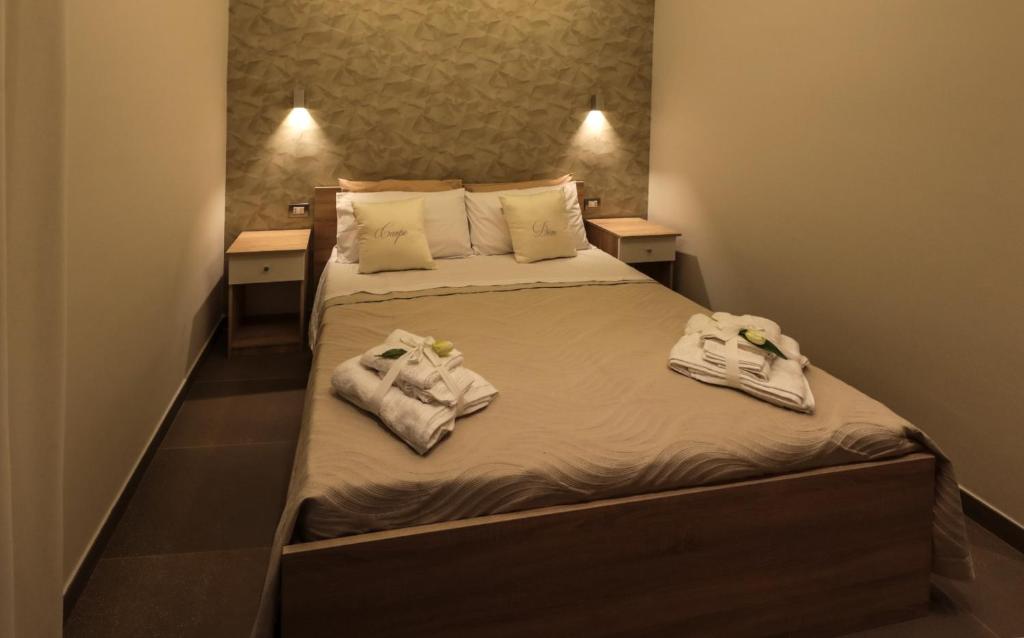 Posteľ alebo postele v izbe v ubytovaní Carpe Diem Rooms