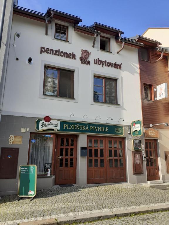 a building with a sign in front of it at Ubytování nad Bisonem in Hlinsko