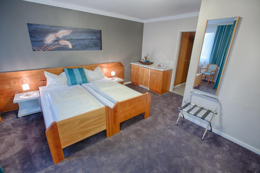 Postel nebo postele na pokoji v ubytování Frühstückshotel Waldbauer