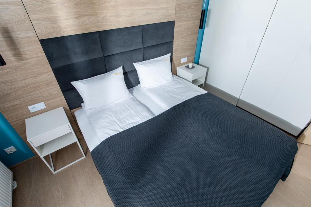 Posteľ alebo postele v izbe v ubytovaní Apartament SŁONECZNY 7 Dziwnów Gardenia z widokiem na morze EPapartamenty