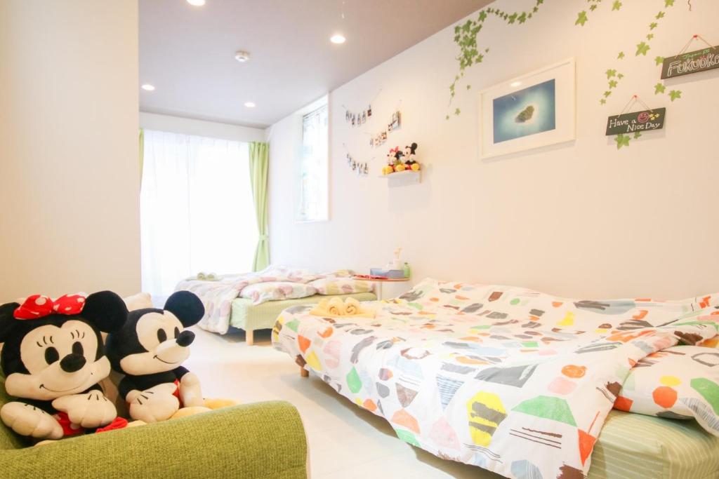 a childrens bedroom with two beds and stuffed animals at Room 301 - Vacation STAY 86506 in Fukuoka