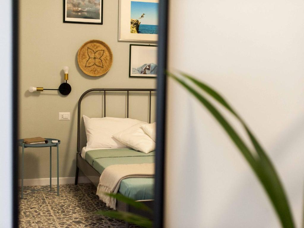 Postel nebo postele na pokoji v ubytování Four Rooms Alghero