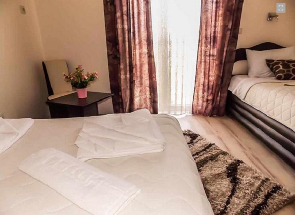 Postel nebo postele na pokoji v ubytování Guesthouse Vila DND