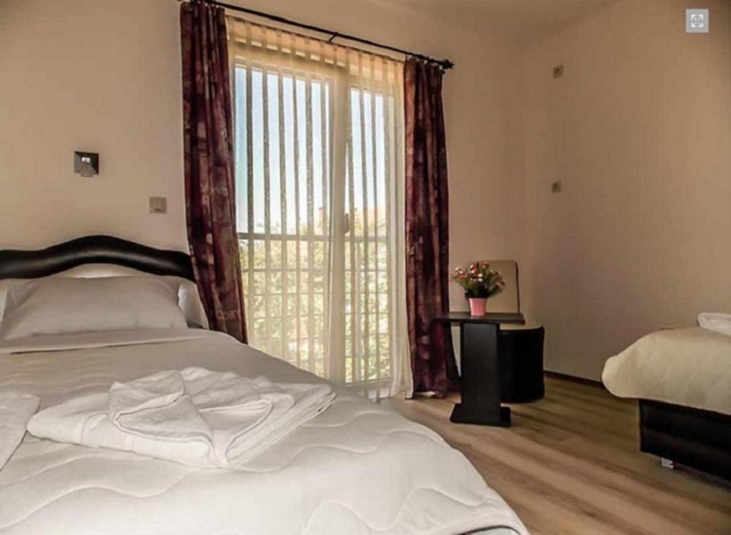 Postel nebo postele na pokoji v ubytování Guesthouse Vila DND