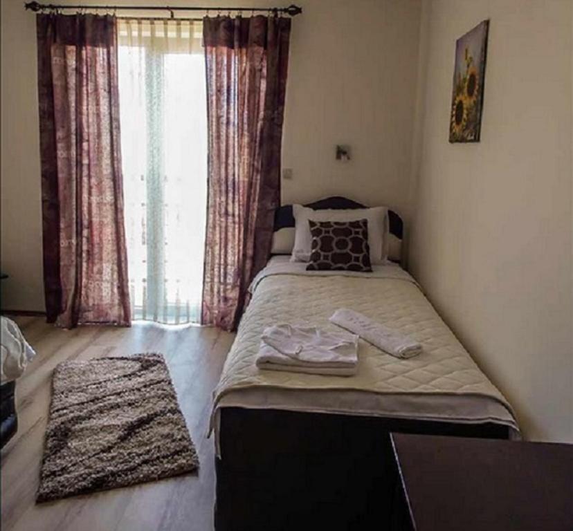 Postel nebo postele na pokoji v ubytování Guesthouse Vila DND