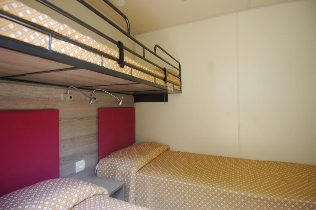 Ein Bett oder Betten in einem Zimmer der Unterkunft Camping Edy