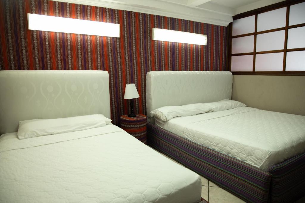 Un pat sau paturi într-o cameră la Casa MiMá