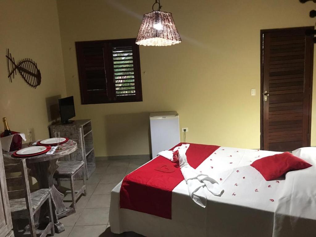 Cama ou camas em um quarto em Pousada Hibiscus