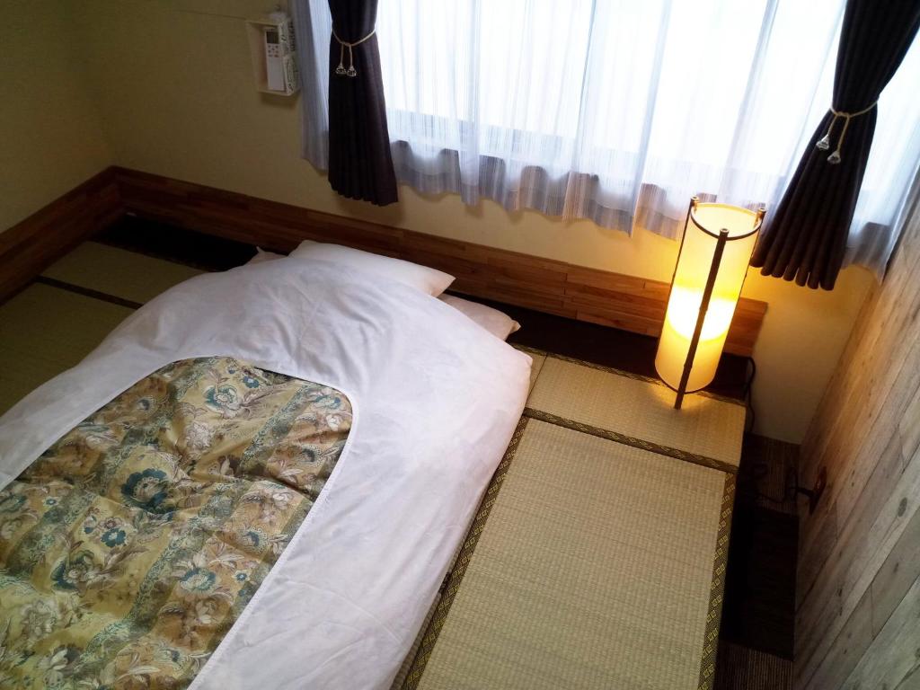 Postel nebo postele na pokoji v ubytování Kyoto Villa Kotone