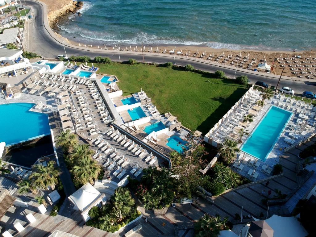 an aerial view of the resort and the beach at The Island Hotel - Adults Only - in Gouves