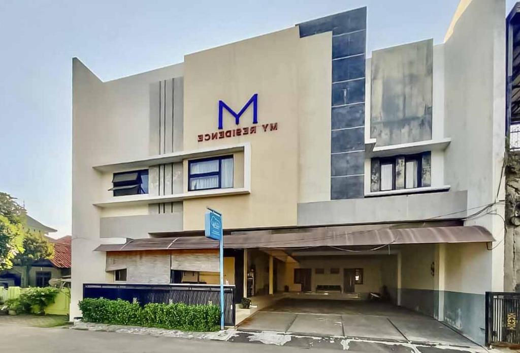 a large building with a m sign on it at RedDoorz Syariah Plus near Cirebon Super Block Mall 2 in Cirebon