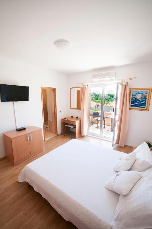 Posteľ alebo postele v izbe v ubytovaní Župa Dubrovačka Guest House