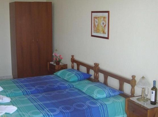 Postel nebo postele na pokoji v ubytování Yianna Studios & Apartments