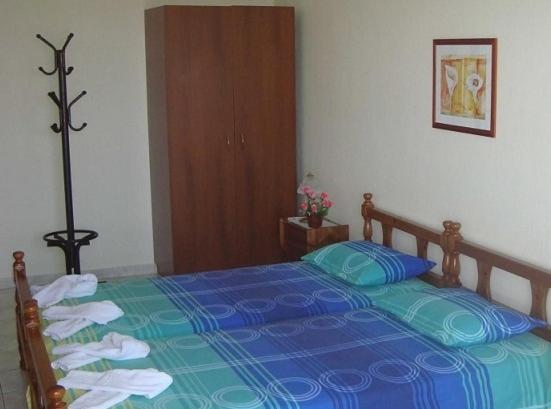 Postel nebo postele na pokoji v ubytování Yianna Studios & Apartments