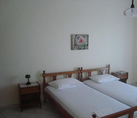 Postel nebo postele na pokoji v ubytování Yianna Studios & Apartments