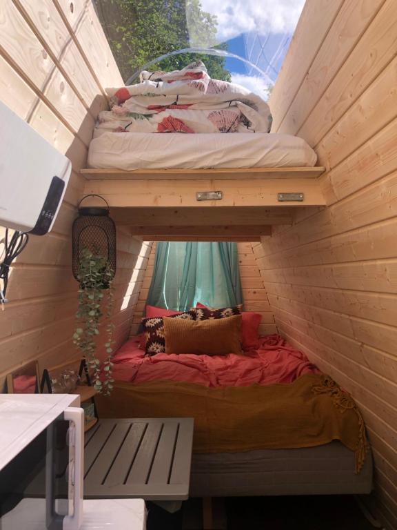 two bunk beds in a room with a window at Family Skylight in Laitila