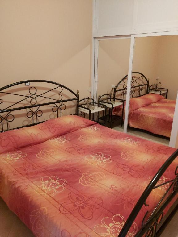 Postel nebo postele na pokoji v ubytování Akrogiali