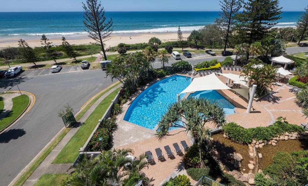 an aerial view of a resort with a swimming pool and the beach at Oceana On Broadbeach in Gold Coast