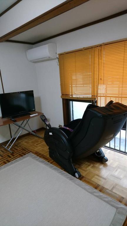 TV a/nebo společenská místnost v ubytování Guesthouse Yoshikawa