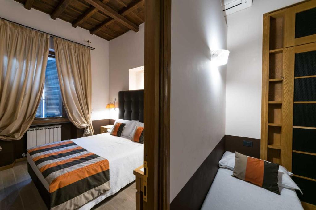 Postel nebo postele na pokoji v ubytování Duca d'Alba Hotel - Chateaux & Hotels Collection