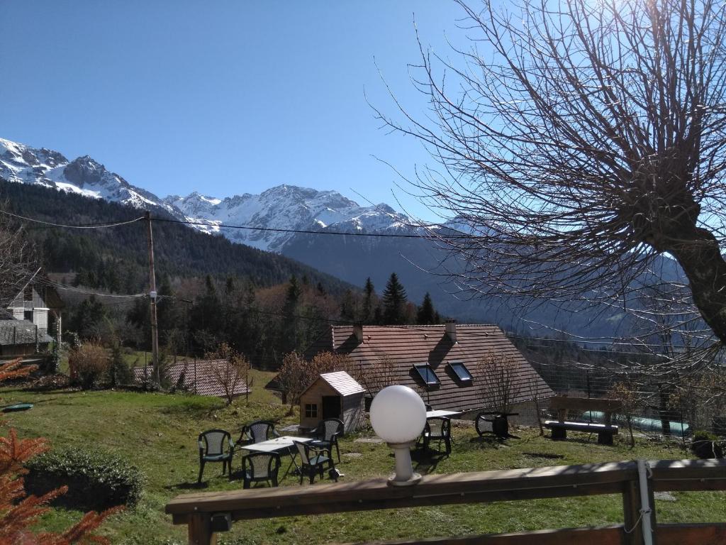 a view of a house with mountains in the background at Auberge du Grand Joly in Sainte-Agnès