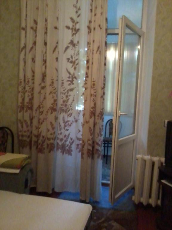 Postel nebo postele na pokoji v ubytování Квартира в центре.