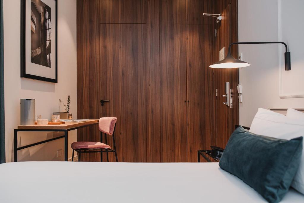 Postel nebo postele na pokoji v ubytování Helen Berger Boutique Hotel