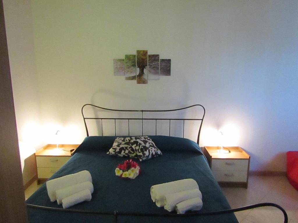 Łóżko lub łóżka w pokoju w obiekcie Casa Vacanze Barone di Civico 24