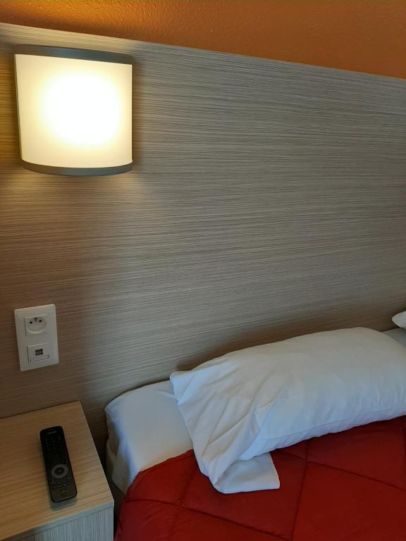 Postel nebo postele na pokoji v ubytování Premiere Classe Carcassonne