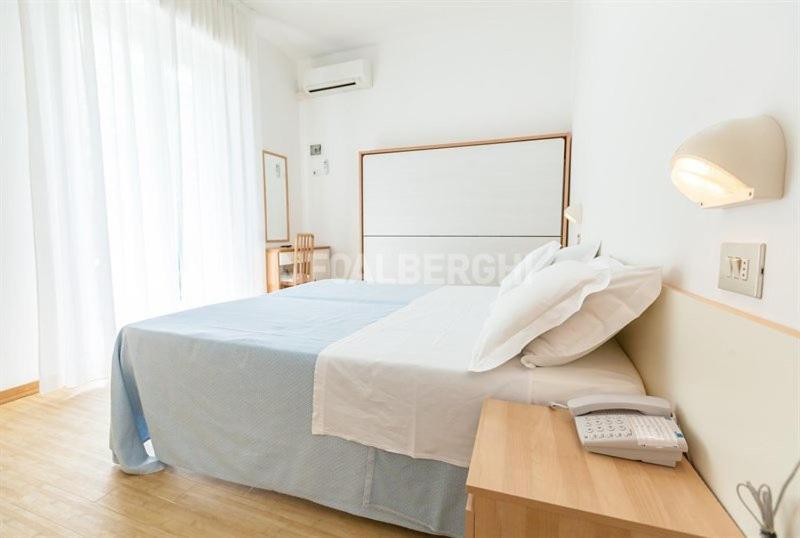 Postel nebo postele na pokoji v ubytování Hotel Azzurro