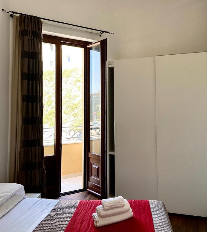 Łóżko lub łóżka w pokoju w obiekcie Iamartino Quality Rooms