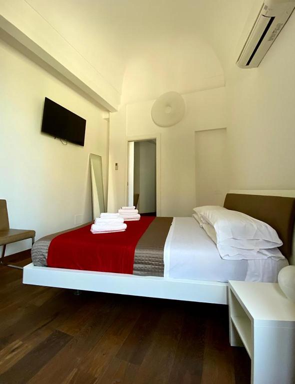 Łóżko lub łóżka w pokoju w obiekcie Iamartino Quality Rooms