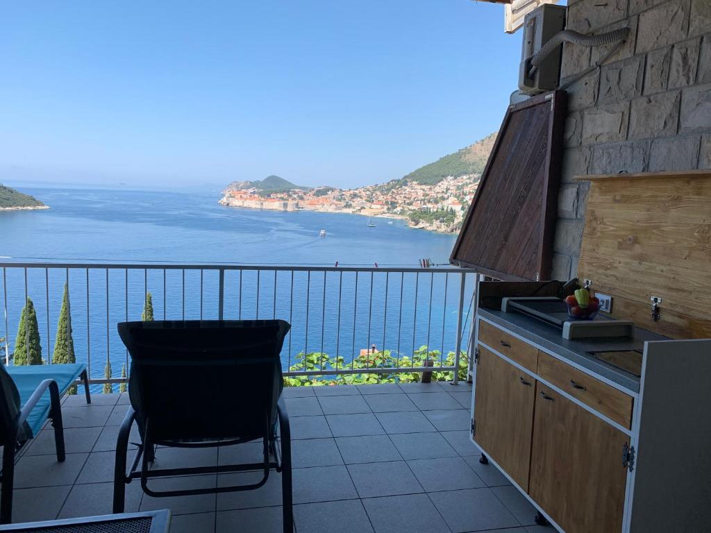 a balcony with a view of the water at Apartment and room Sveti Jakov in Dubrovnik