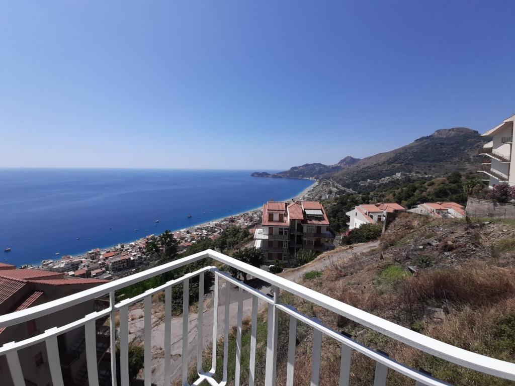 a view of the ocean from a balcony at CASA VACANZE DONNA YULIYA in Letojanni