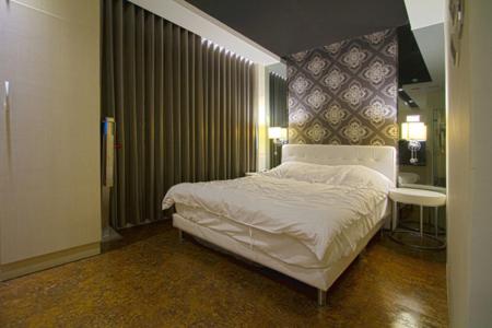 Postel nebo postele na pokoji v ubytování 澎湖寶島時尚別館 Bao Dao B&B