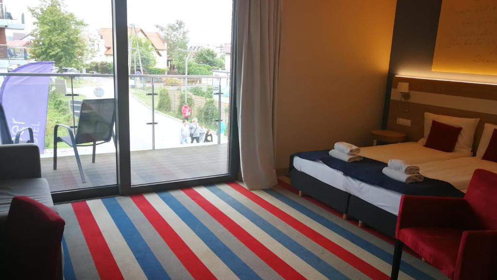 Postel nebo postele na pokoji v ubytování Hotel Skipper
