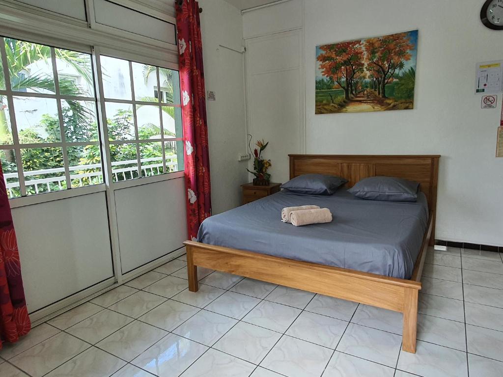 Postel nebo postele na pokoji v ubytování Hotel CHEZ PAPA DAYA