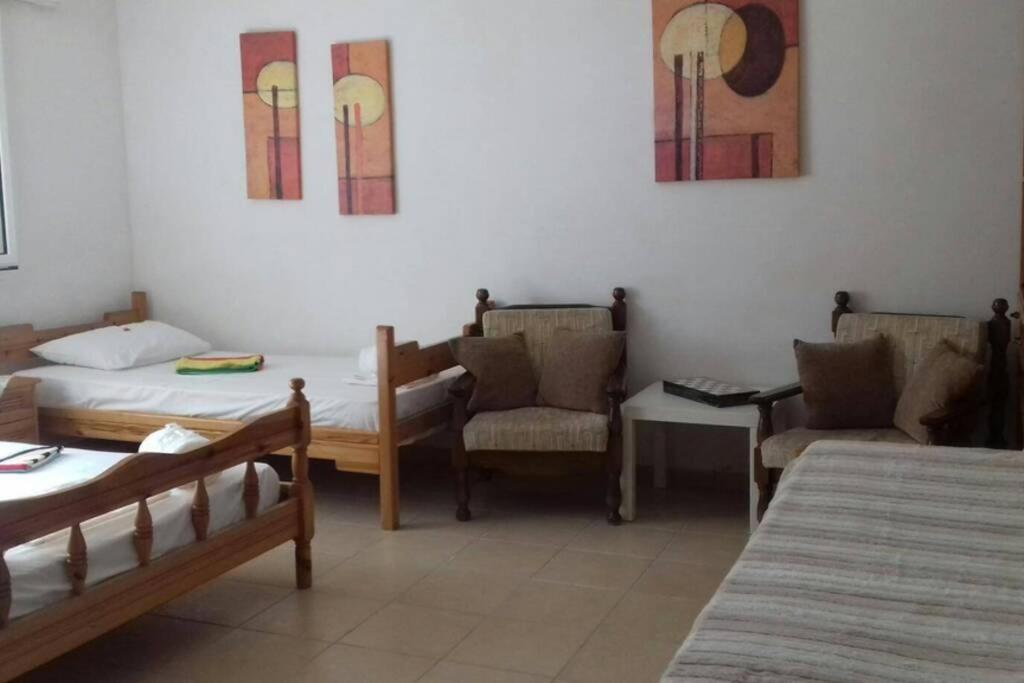 Postel nebo postele na pokoji v ubytování Yria Suite Zakynthos
