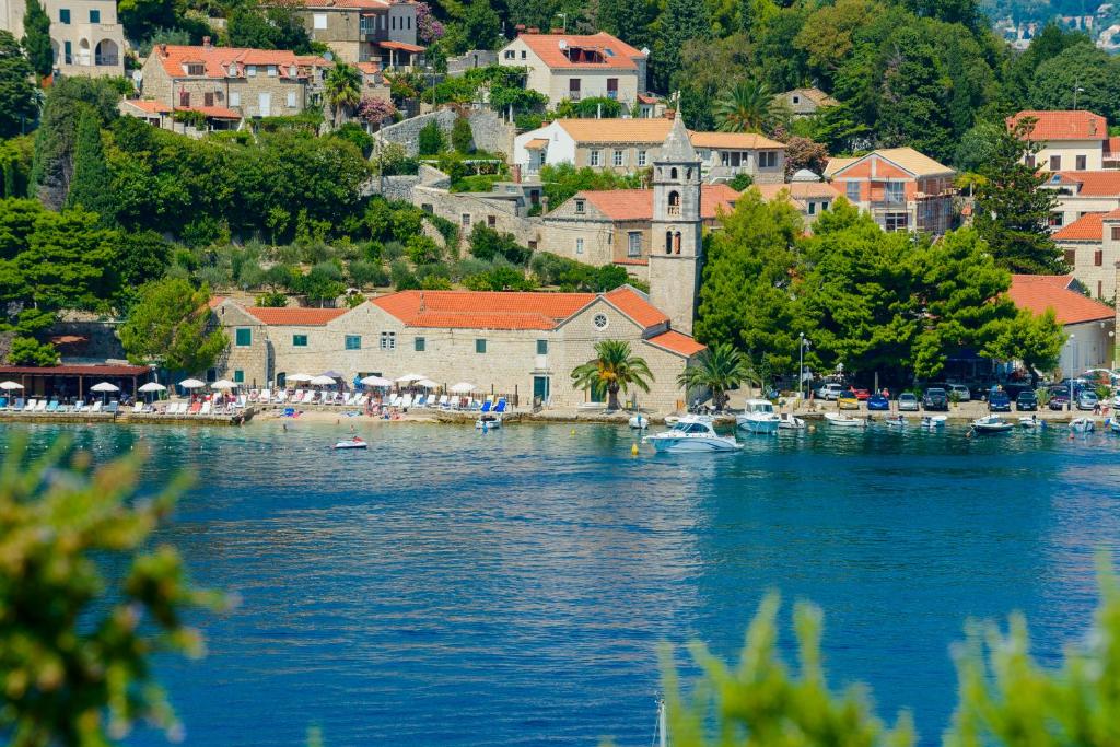 a large body of water with boats in a town at Sobe More Cavtat in Cavtat
