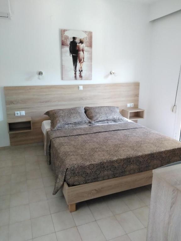 Łóżko lub łóżka w pokoju w obiekcie Hotel Dimitra Sun