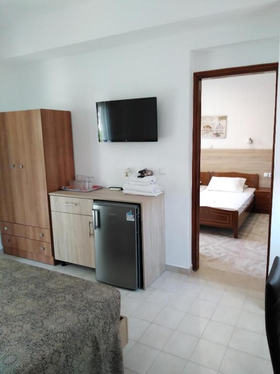 Łóżko lub łóżka w pokoju w obiekcie Hotel Dimitra Sun