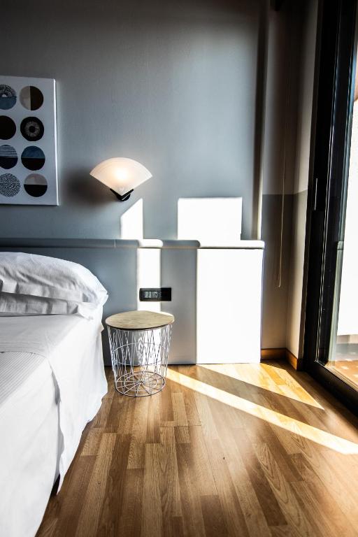 Postel nebo postele na pokoji v ubytování Hotel Concorde