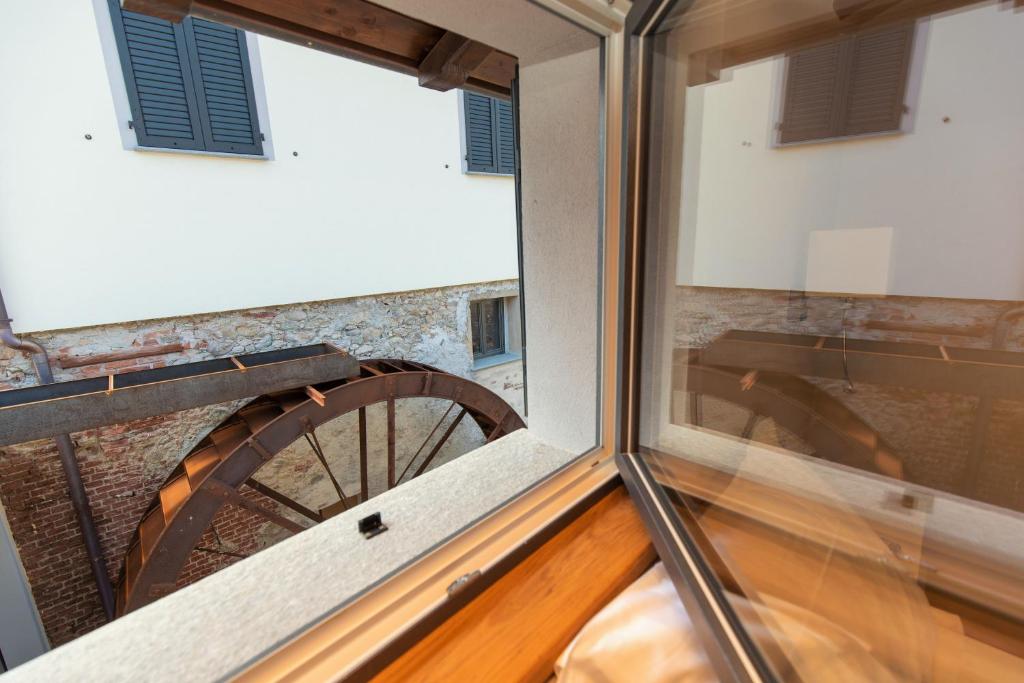 a view from the balcony of a building with a window at Er Mirin - Il Mulino di Carcare Hotel in Carcare