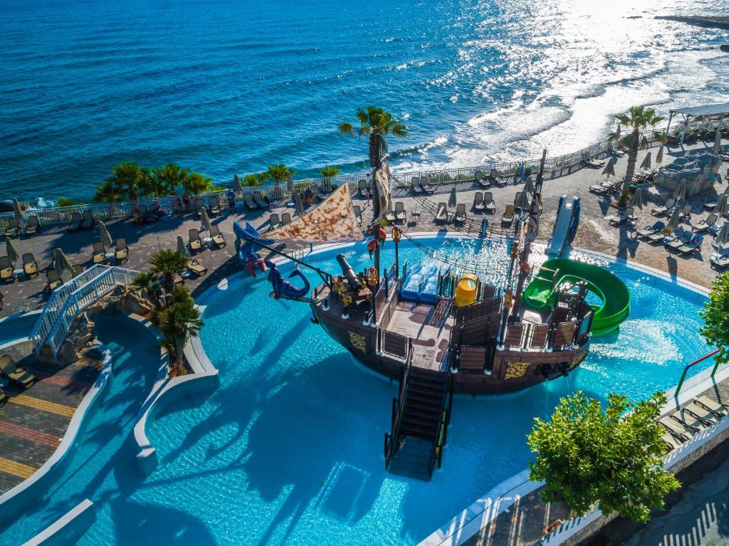an aerial view of a water park with a roller coaster at Star Beach Village & Water Park in Hersonissos