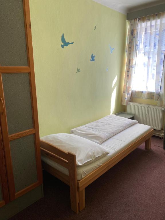 Postel nebo postele na pokoji v ubytování Hotel Praděd Rýmařov