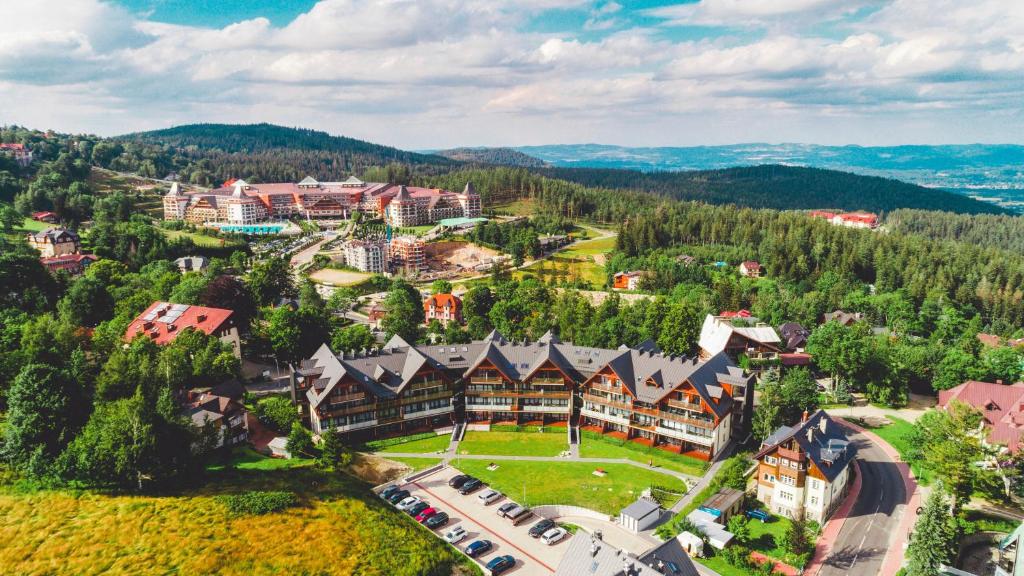 an aerial view of a resort in the mountains at Apartamenty Sun & Snow Triventi Mountain Residence in Karpacz