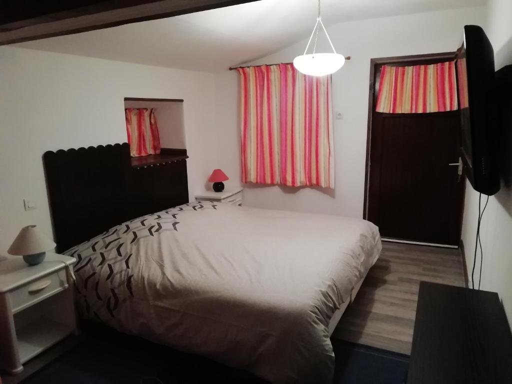 Postel nebo postele na pokoji v ubytování Au verger de Marcilly