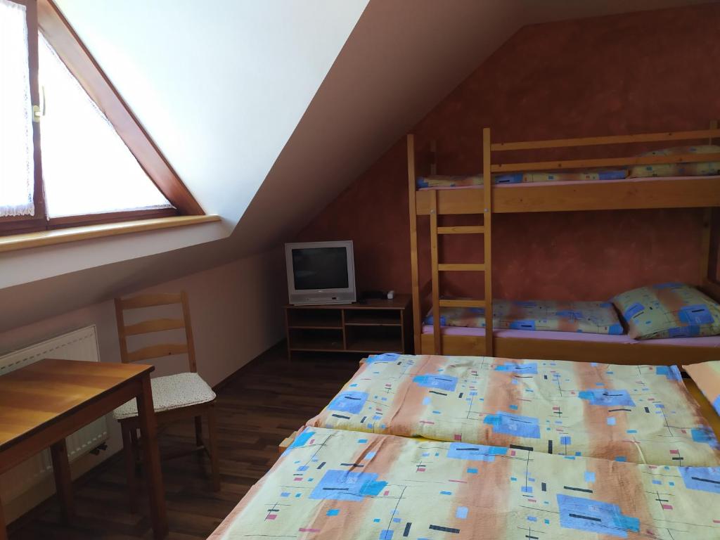 Postel nebo postele na pokoji v ubytování Ubytování U Bohouše