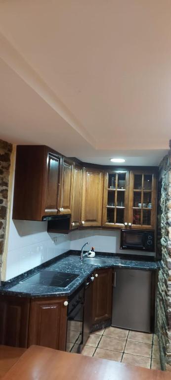 Kuchyň nebo kuchyňský kout v ubytování CASA MUNIELLOS
